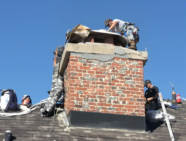 Streetsboro Chimney Sweep installing a custom chimney crown in Streetsboro, OH